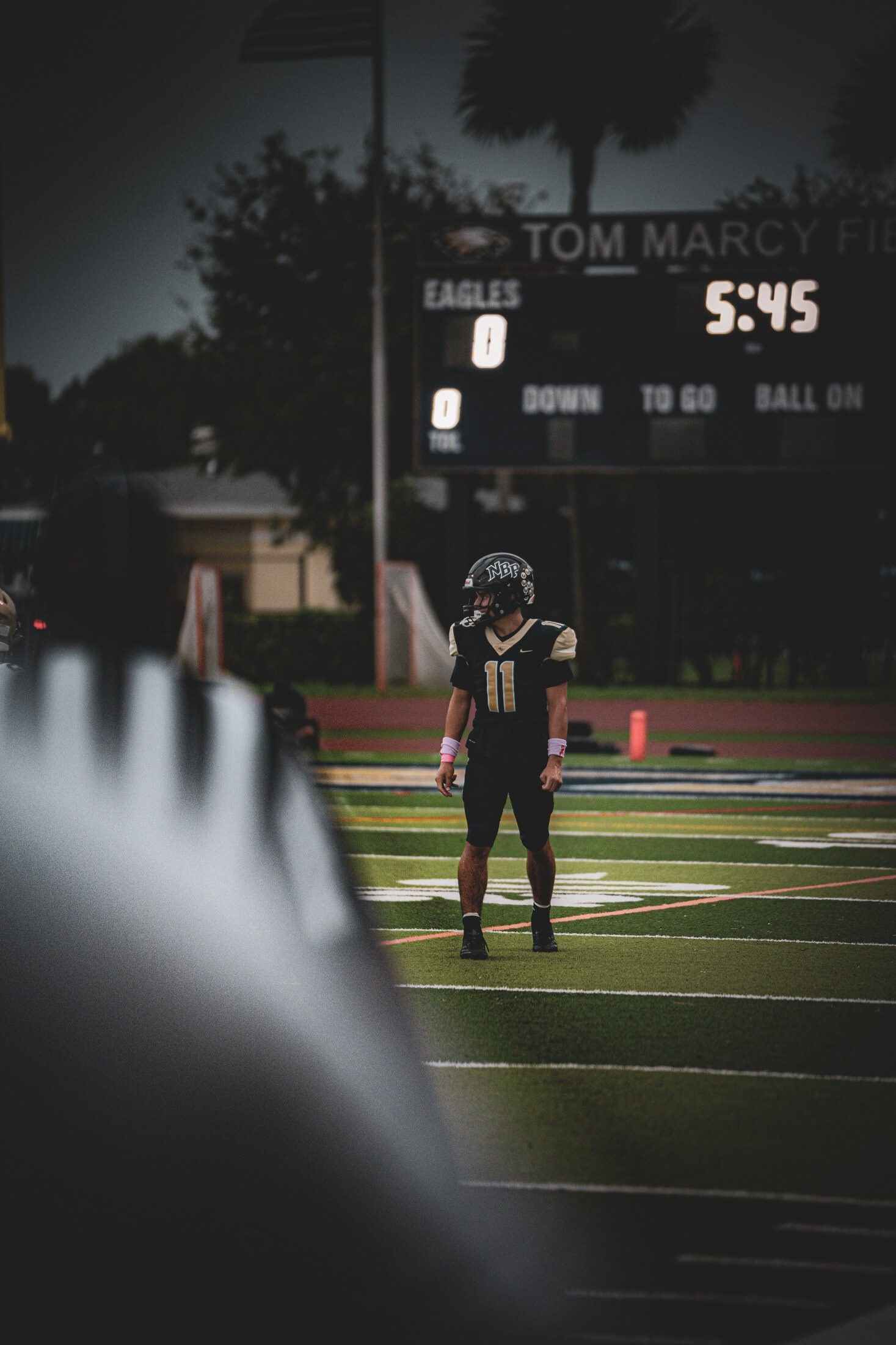 Stadium scoreboard under the Friday night lights