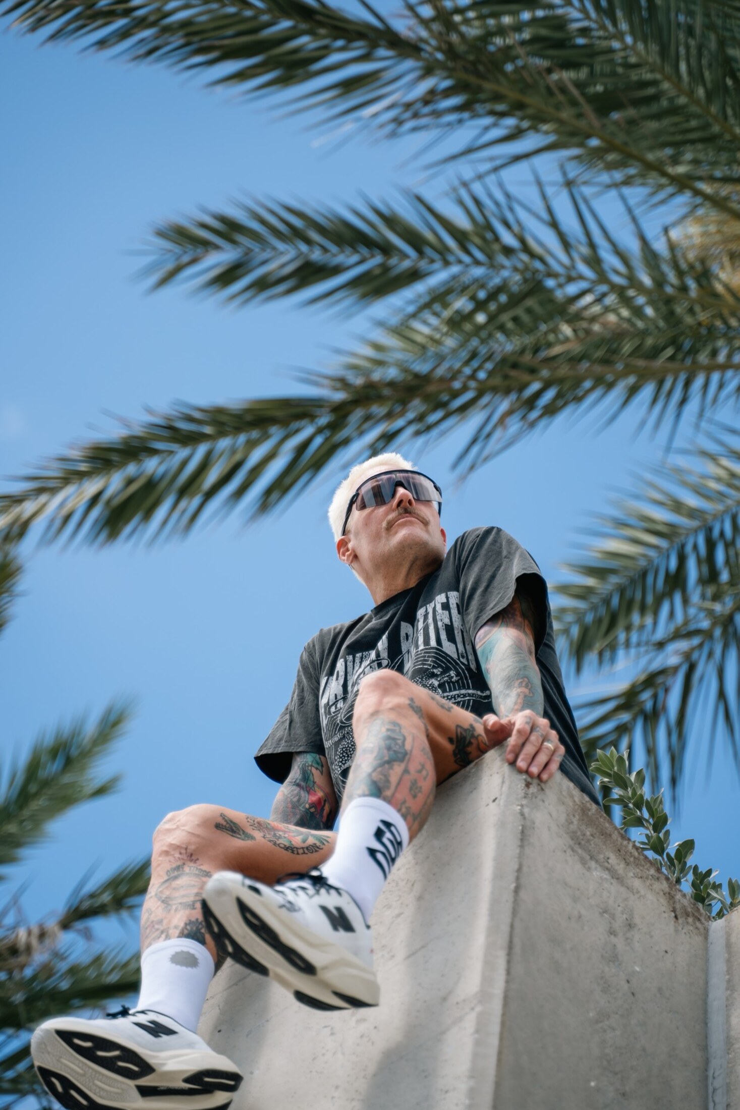 Low-angle portrait under the palms