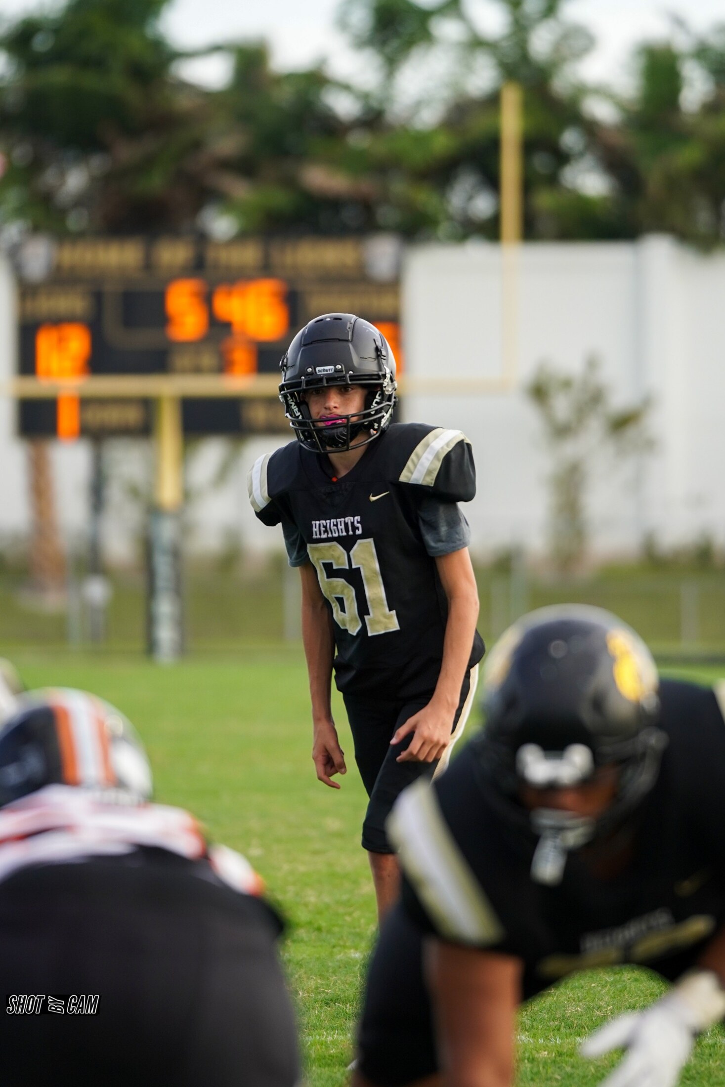 Football players set at the line of scrimmage