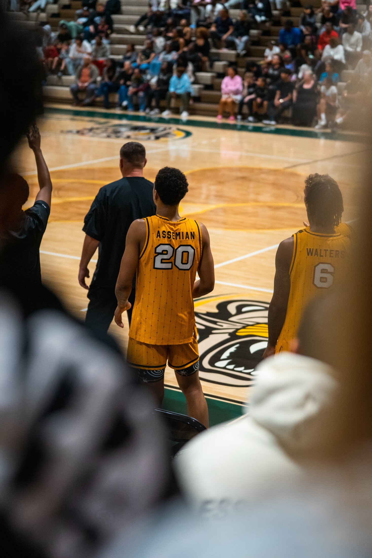 Basketball players pushing the ball in transition