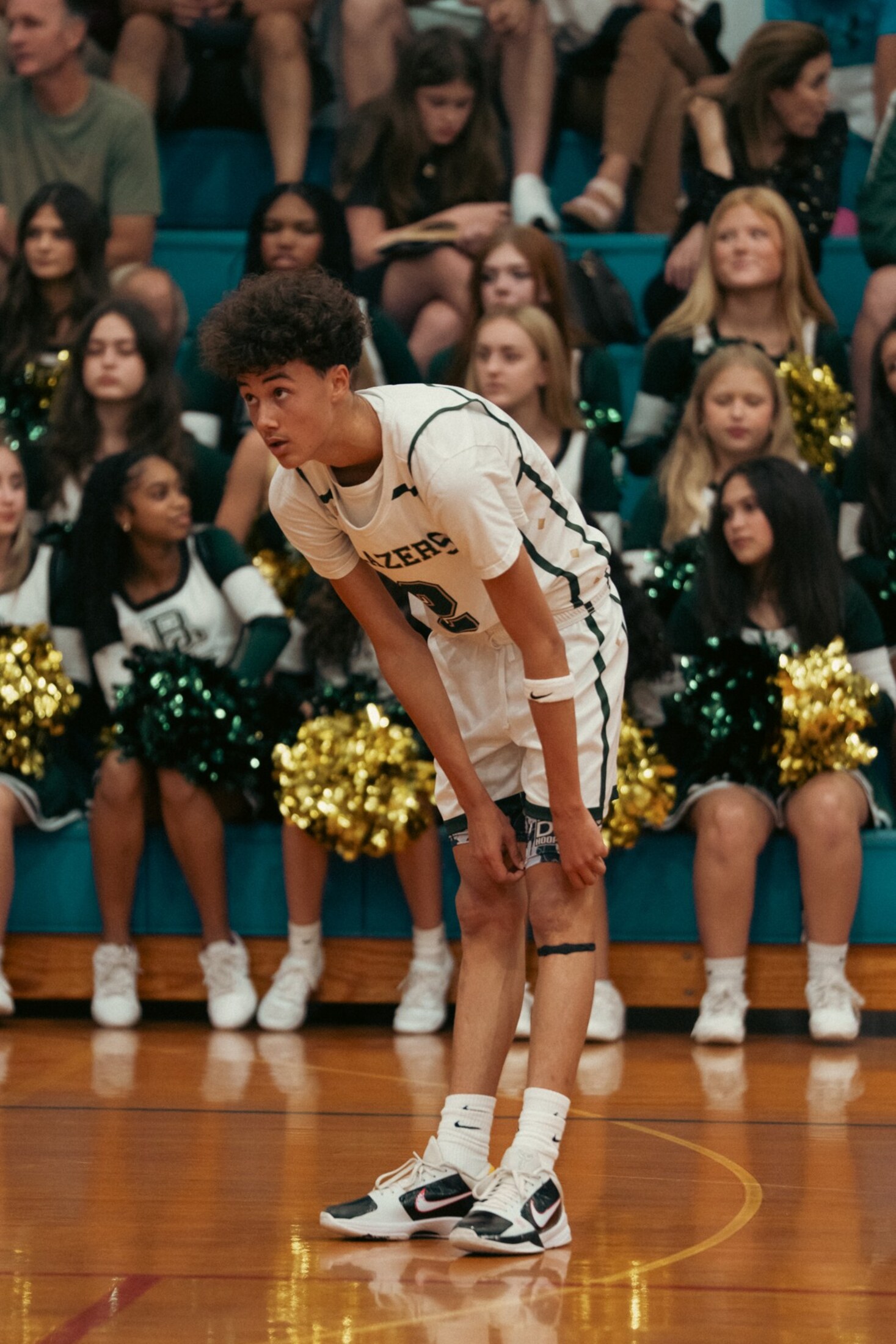 Basketball player catching his breath at the line