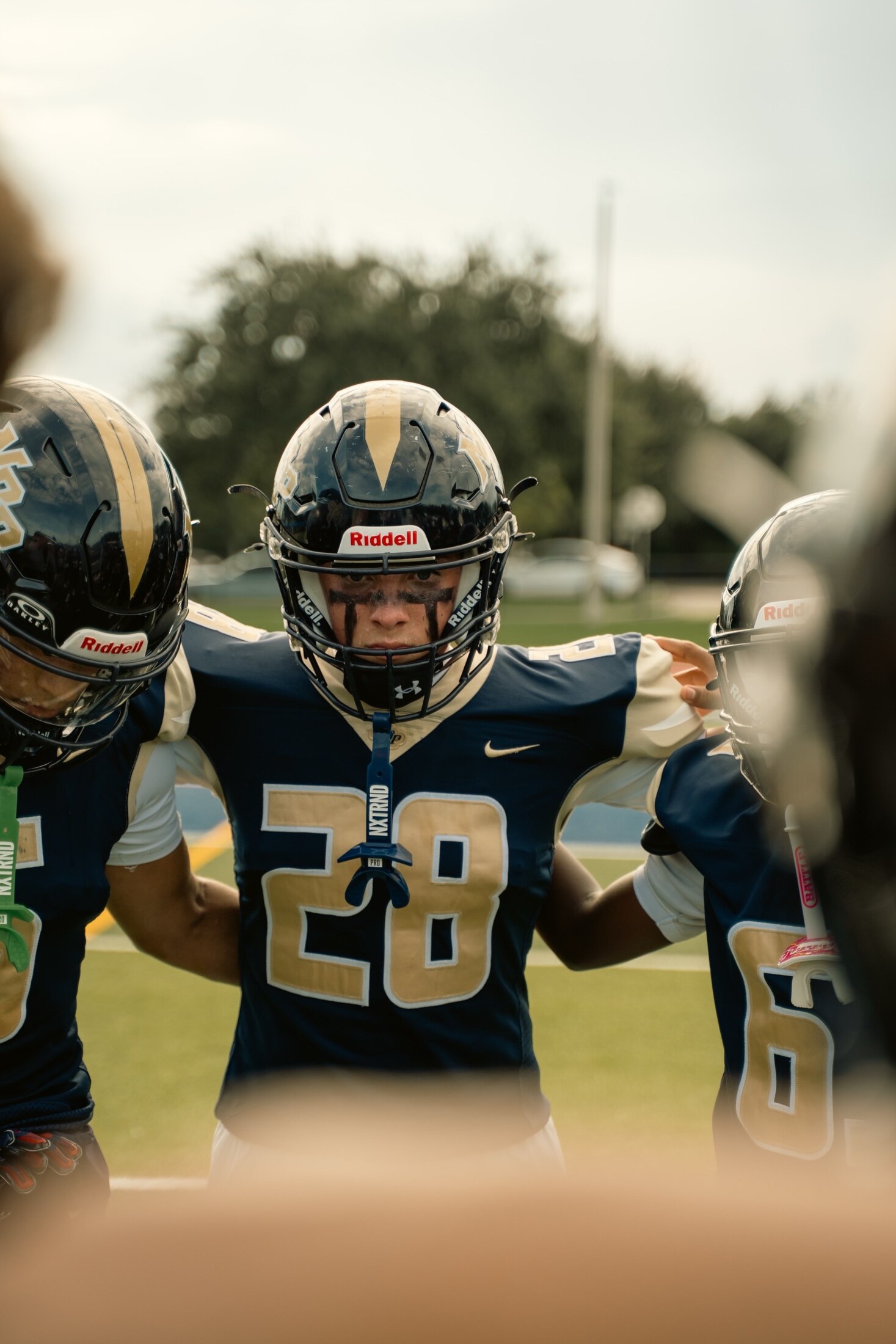 Football players locked in during the huddle
