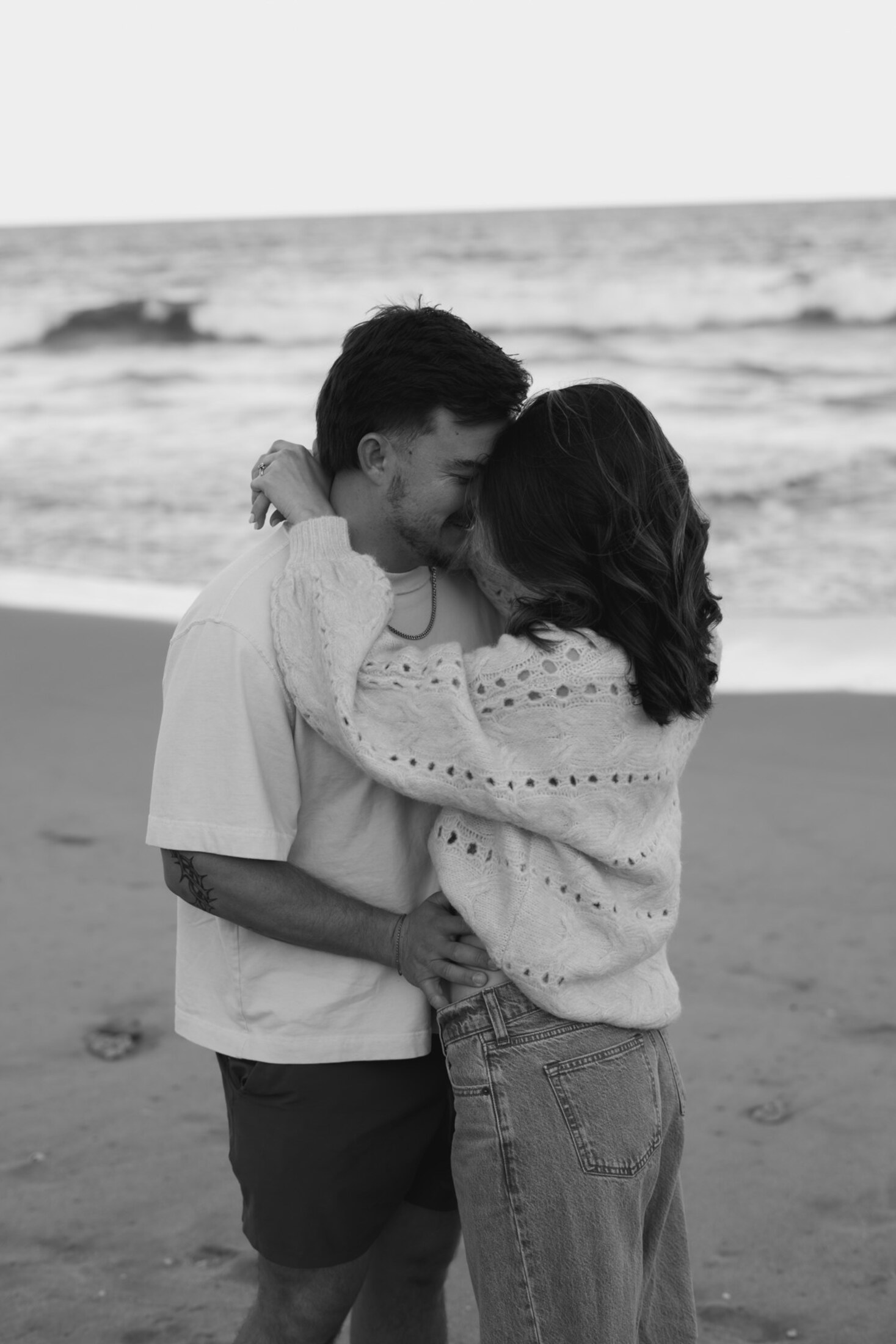 Black and white portrait of a couple on the beach