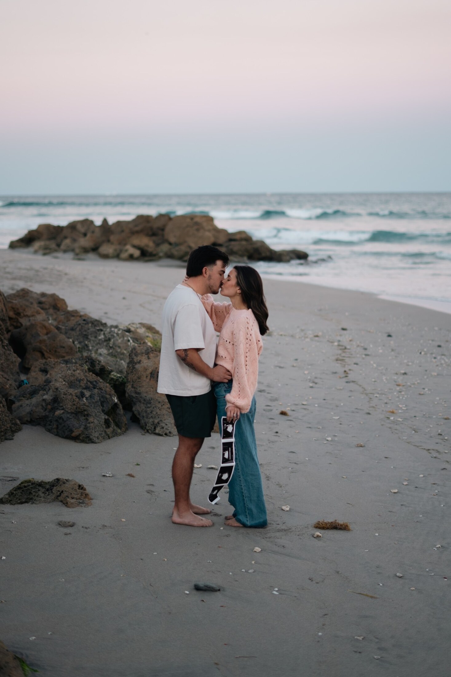 Couple on the beach at dusk